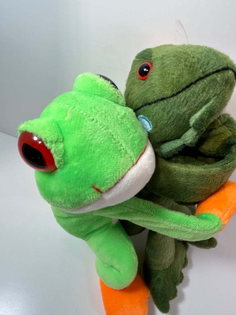 Wild Republic Wrist Hugger Iguana and Rain Forest Frog plush bracelets